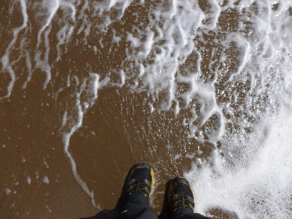 The North Sea washing around David's boots