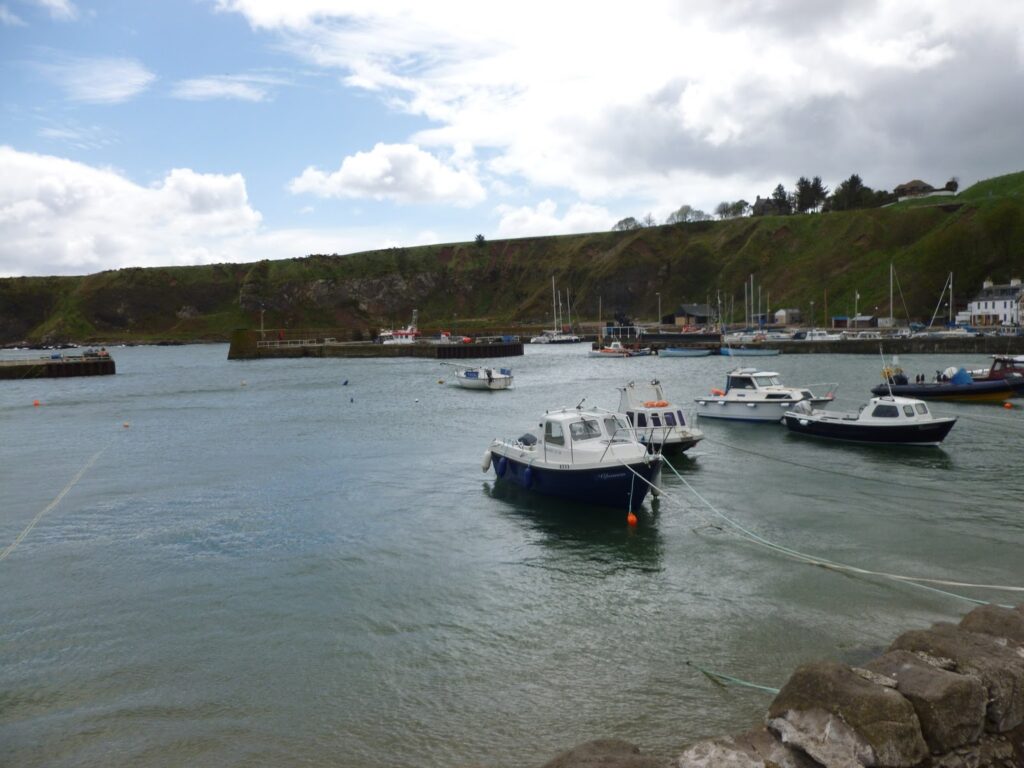 Small boats moored in Stonehaven harbour.