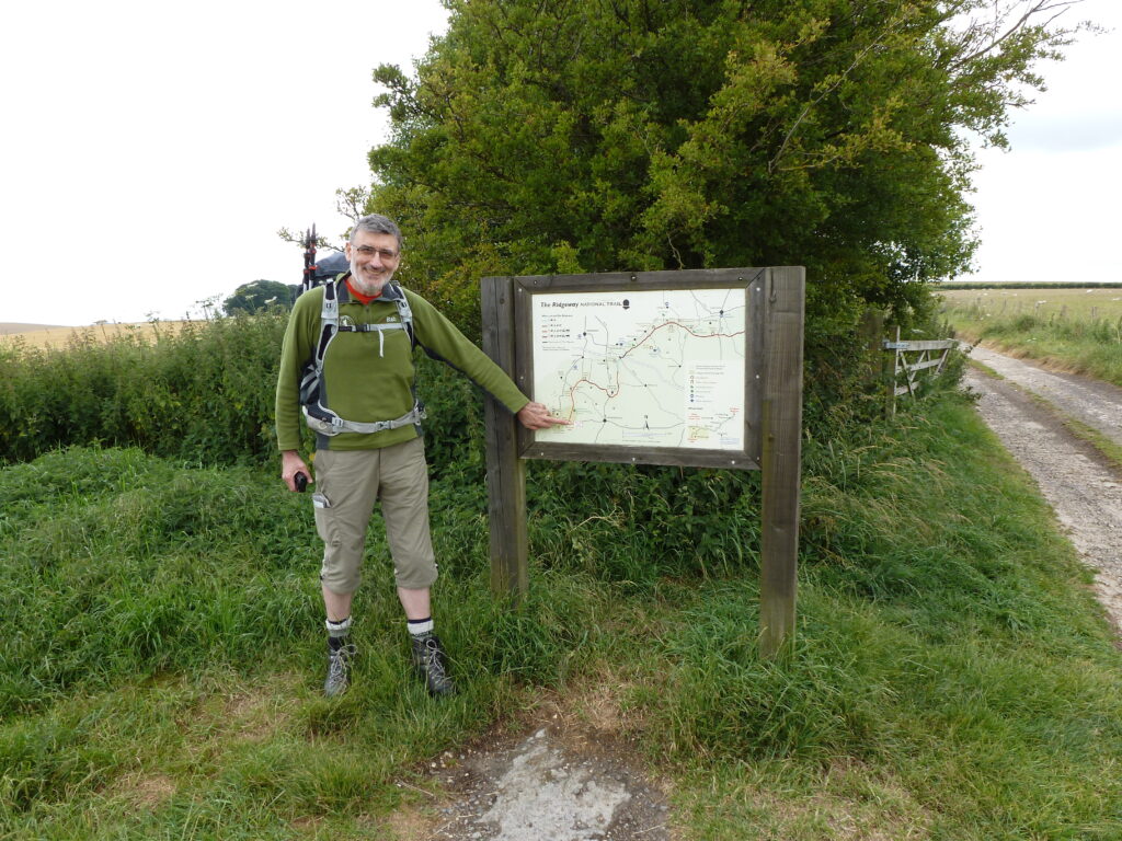 Alan pointing at map displayed at car park