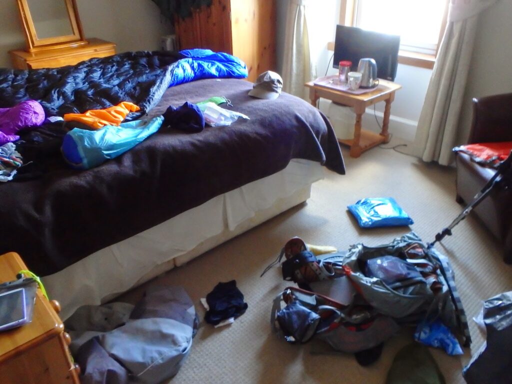 Bedroom with kit strewn everywhere