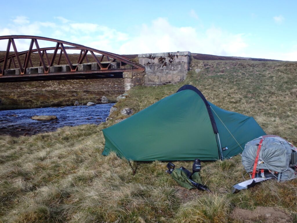 Tent pitched by bridge