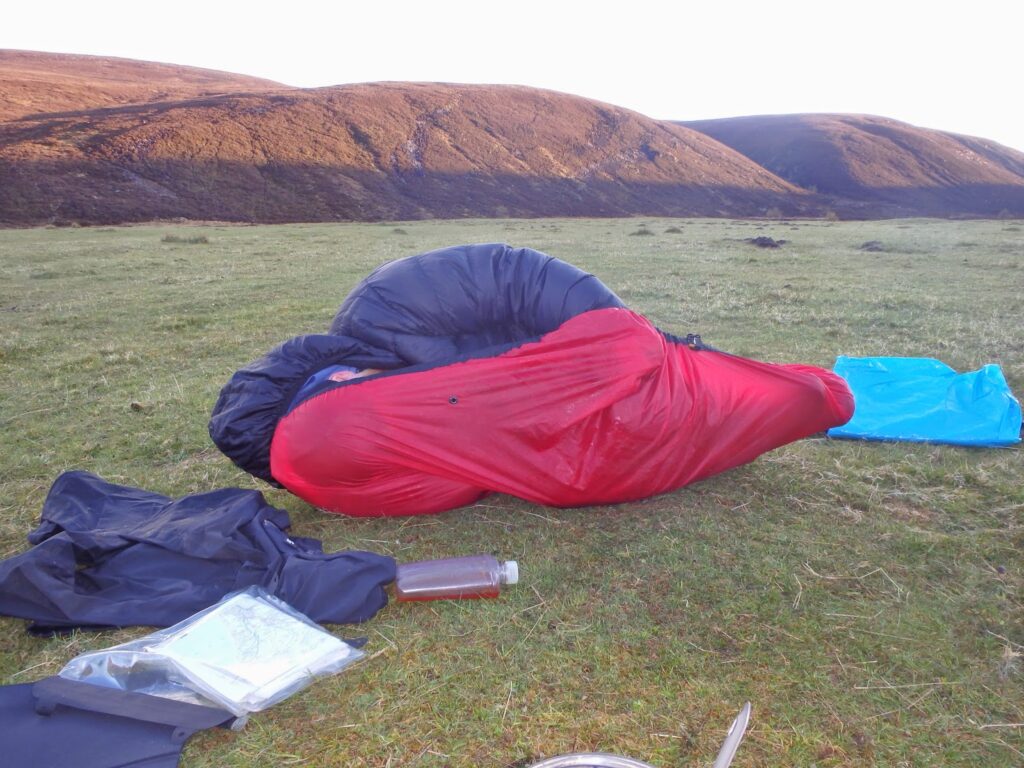 Two people wrapped up in sleeping bag, I think