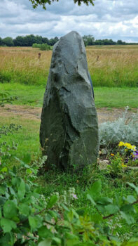 The stone from behind, resembling the silhouette of a nun