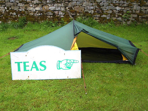 Mike's tent with a sign pointing to a tearoom