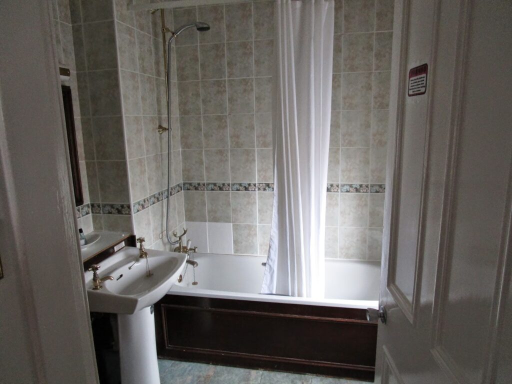 Bathroom with shower and a bath tub
