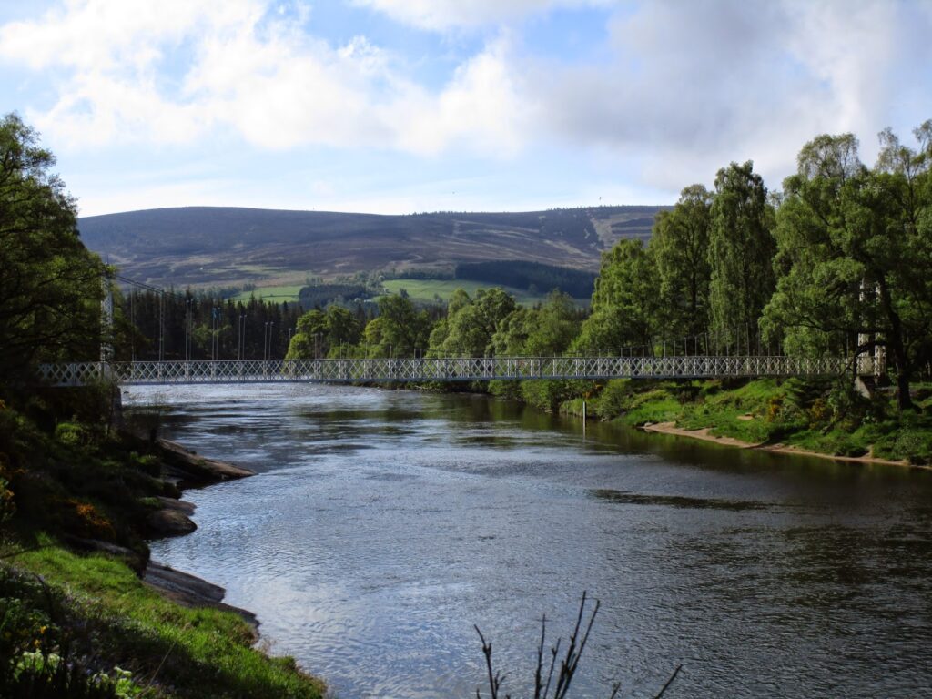 Cambus O' May Bridge seen in distance  from the path 