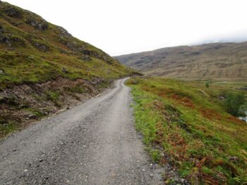 Hillside track surface with compacted stone