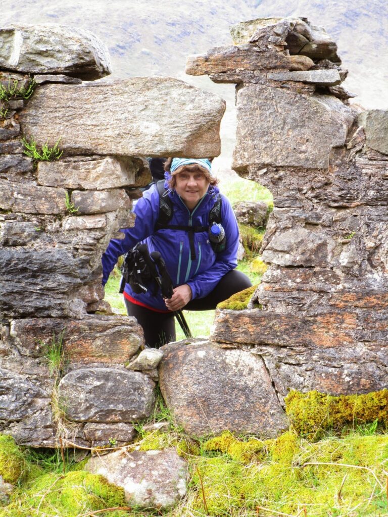 Vicky peering through a hole in the old garrison ruins