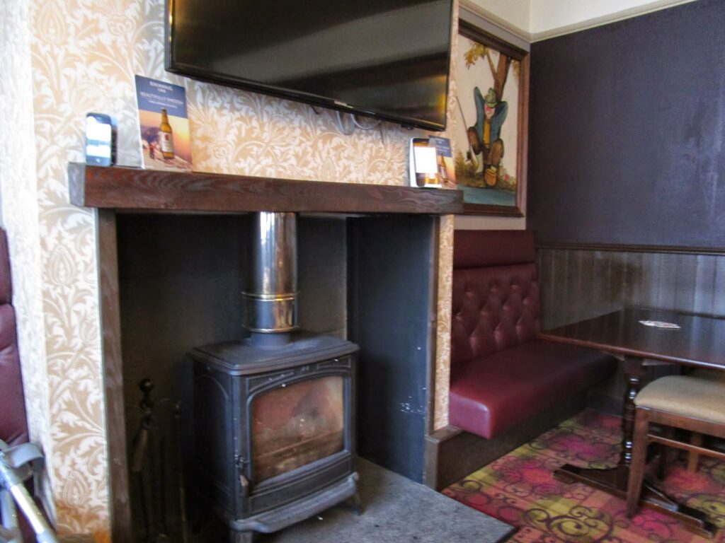 Fireplace with a wood burning stove.