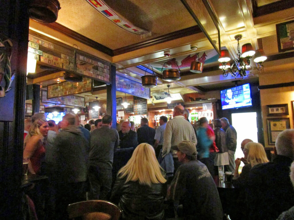 The audience listening to the band.