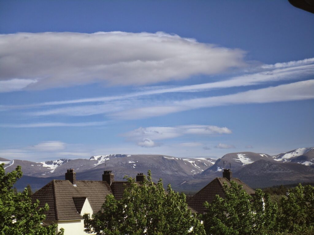 Sunny day with the Cairngorms capped with snow patches