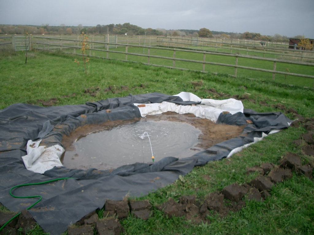 Pond being filled from a hose